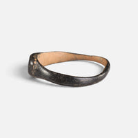 Byzantine bronze ring 'Isidoros' shows its small bezel edge and narrow hoop from the opposite side.
