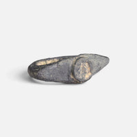 Roman bronze ring 'Equidus' shows its worn circular bezel and broad shoulders at an angle.