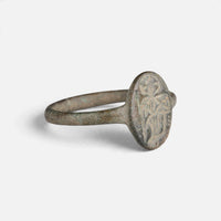 Byzantine bronze ring 'Kassia' shows its worn oval bezel device and narrow shoulder at an angle.