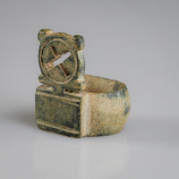 Angled view of Byzantine bronze ring Stavros highlighting incised shoulder panels and cross bezel