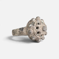 Byzantine silver ring 'Thalios' shows its pierced domed bezel and broad shoulder at an angle.