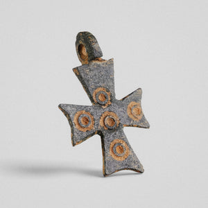 Angled view of Byzantine bronze cross pendant 'Okellaris' showing the integral suspension loop