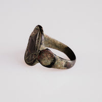 Angled view of medieval bronze ring Aldwyn revealing bezel geometry and hoop transition