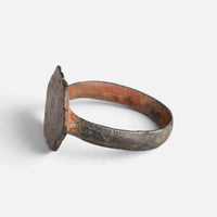 Medieval bronze ring 'Radvina' shows its lobed bezel edge and hoop from the opposite side.