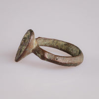 Angled view of medieval bronze ring Vetka displaying integral cast construction