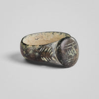 Angled view of medieval bronze ring 'Wistan' with patina and shoulder decoration