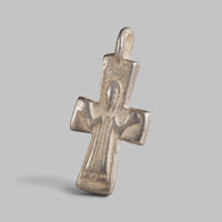Angled view of Peristeria Byzantine silver cross pendant with integral cast suspension loop