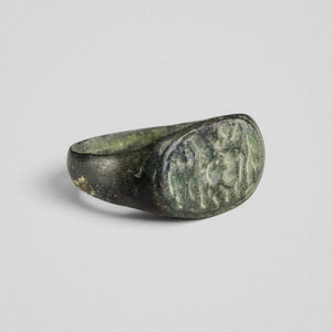 Angled view of Roman bronze ring Equirius highlighting oval bezel and tapering shoulders