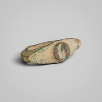 Angled view of Roman bronze ring 'Tullia' showing green and red corrosion on shoulders