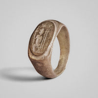 Angled view of Roman silver ring Solaris highlighting the figure and vertical elements on the bezel