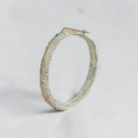 Back of hoop view of Stellira medieval bronze ring showing patinated D-section band