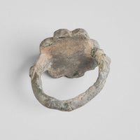 Back of medieval bronze ring Rosalind showing patina and lobed bezel reverse