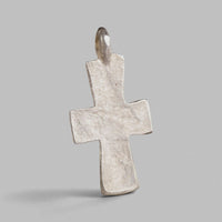 Back of Peristeria silver pectoral cross showing flared Latin cross form and cast loop