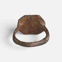 Medieval bronze ring 'Anselm' shows the plain back of its octagonal bezel and the inner hoop.