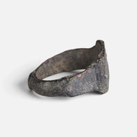 Roman bronze ring 'Lucina' shows its broad inner shoulder and the back of the hoop at an angle.