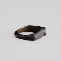 Back view of Roman bronze ring Numerius revealing narrow band and tenorite patina