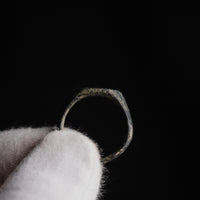 Backlit interior view of medieval silver ring Radomir showing hoop cross-section