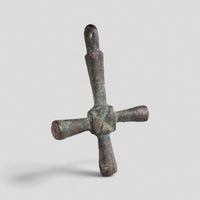 Byzantine bronze cross pendant Chariton showing integral suspension loop and green malachite patina, angled view