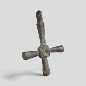 Byzantine bronze cross pendant Chariton showing integral suspension loop and green malachite patina, angled view