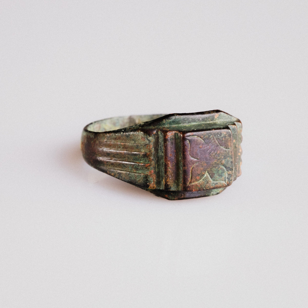 Byzantine bronze ring Aetheria, three-quarter view showing ribbed stepped shoulders and patina