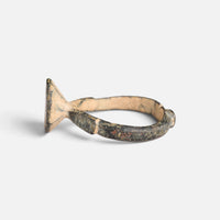 Byzantine bronze ring 'Damianos' shows its bezel edge and shoulder from the opposite side.