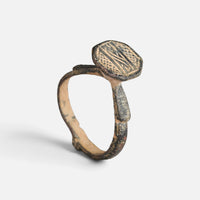 Byzantine bronze ring 'Damianos' shows linear engraving on its octagonal bezel above the full hoop.