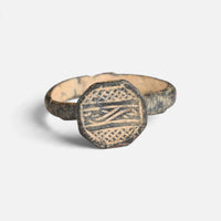 Byzantine bronze ring 'Damianos' shows linear and cross-hatched engraving on its octagonal bezel face.