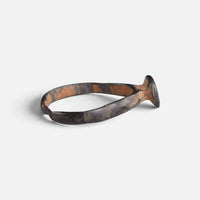 Byzantine bronze ring 'Georgios' shows its raised bezel edge and narrow hoop from the side.