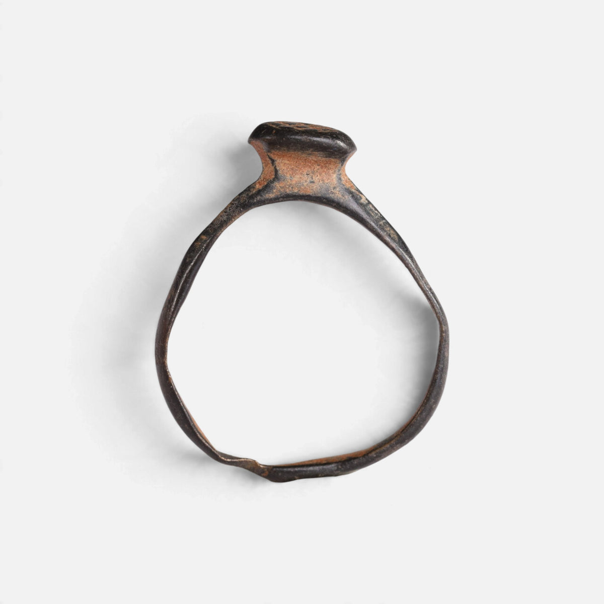 Byzantine bronze ring 'Georgios' shows its raised round bezel edge above the complete hoop in profile.