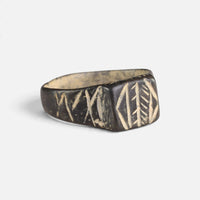 Byzantine bronze ring 'Ioanna' shows its bezel engraving and decorated shoulder at an angle.