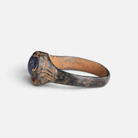 Byzantine bronze ring 'Kallinike' shows its raised setting and grooved shoulder from the opposite side.