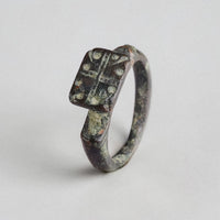 Byzantine bronze ring Kyros showing rectangular bezel and lateral wing-shoulders