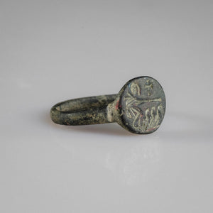 Byzantine bronze ring Mikhael showing oval bezel iconography and tapered hoop, angled view