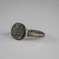 Byzantine bronze ring Mikhael, three-quarter view highlighting cast bezel relief