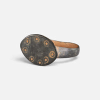 Byzantine bronze ring 'Okellina' shows its ring-and-dot bezel border from the opposite front angle.