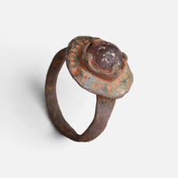 Byzantine bronze ring 'Porphyra' shows a purple setting and dotted bezel border above the complete hoop.