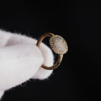 Byzantine bronze ring Theodora held in gloved hand showing bezel scale and detail