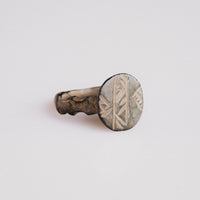 Byzantine bronze ring Theodulos showing engraved circular bezel and stepped shoulder