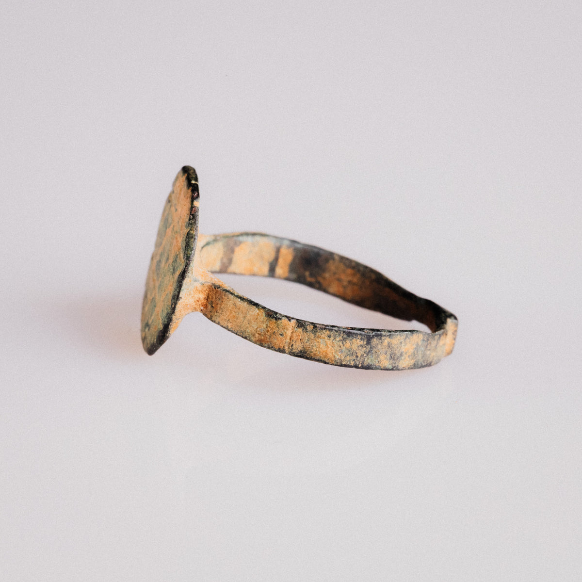 Byzantine bronze ring Theoktistos angled view highlighting patina and bezel edge