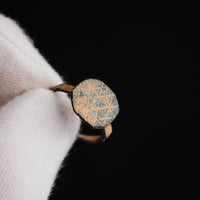 Byzantine bronze ring Theoktistos macro of octagonal bezel with lattice engraving
