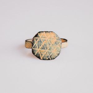 Byzantine bronze ring Theoktistos showing octagonal bezel with geometric lattice engraving