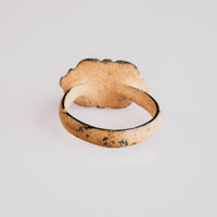 Byzantine bronze ring Theoxena rear view with earthy calcareous burial patina on hoop