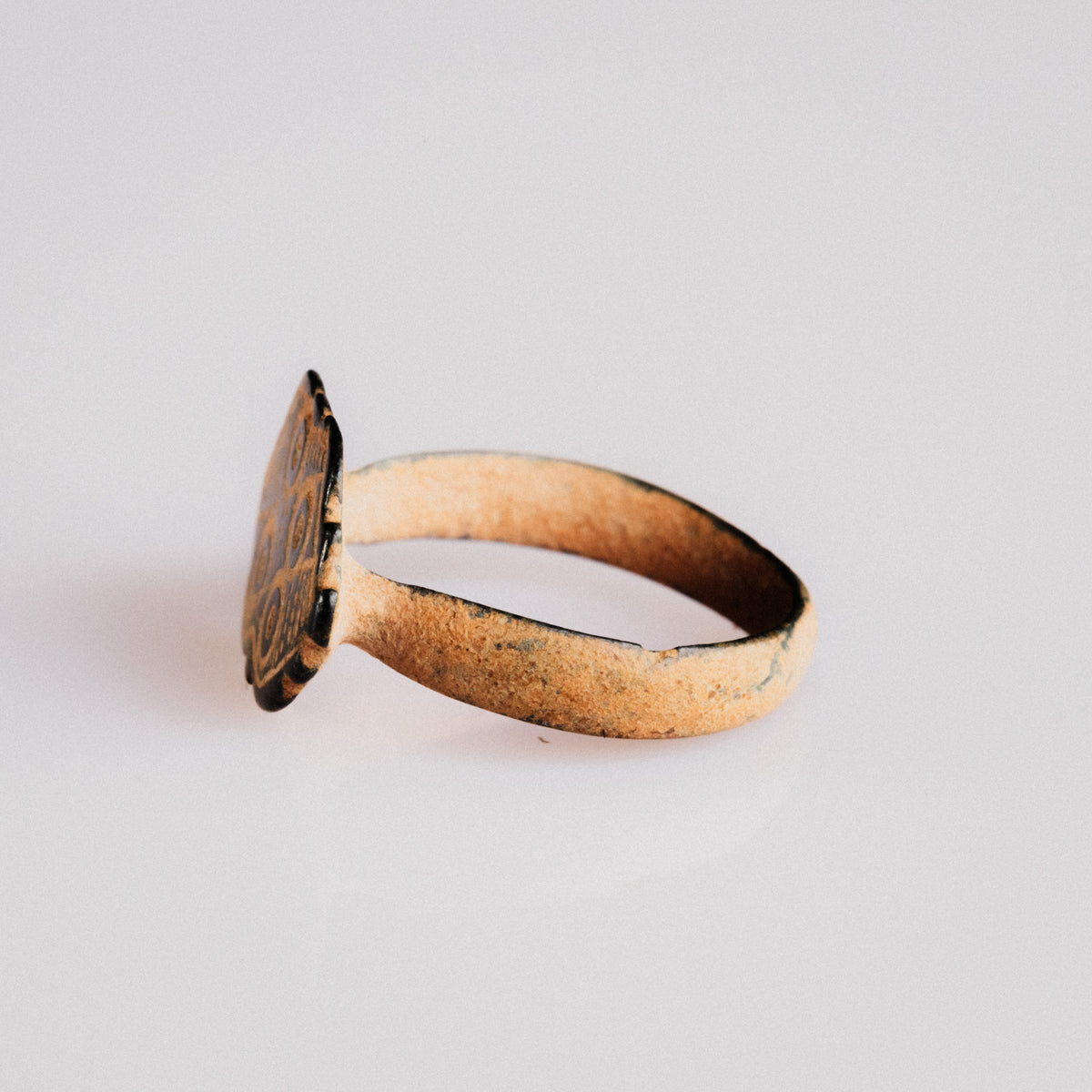 Byzantine bronze ring Theoxena three-quarter view of scalloped bezel and shoulders