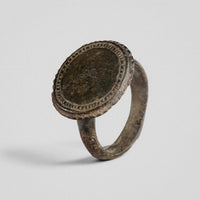 Byzantine bronze ring Xenaros showing hatched double border and worn central field