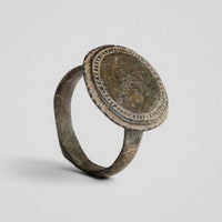 Byzantine bronze ring Xenaros with large flat oval bezel, three-quarter view
