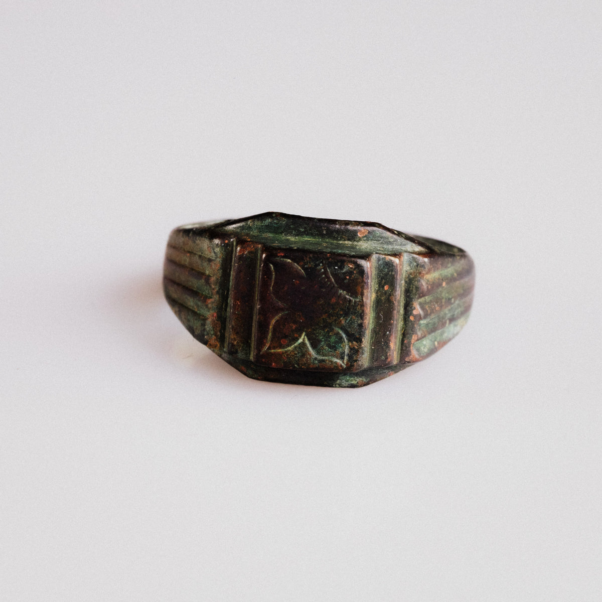 Byzantine bronze signet ring Aetheria with engraved floral bezel, front view showing rectangular platform