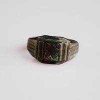 Byzantine bronze signet ring Aetheria with engraved floral bezel, front view showing rectangular platform