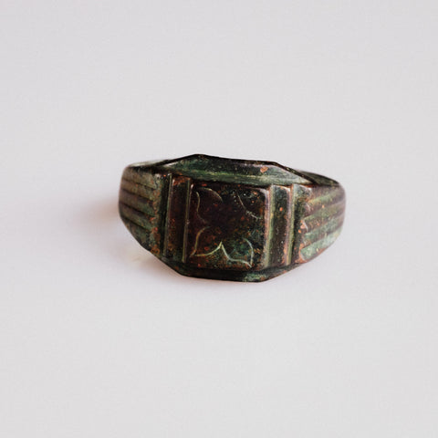 Byzantine bronze signet ring Aetheria with engraved floral bezel, front view showing rectangular platform
