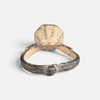 Byzantine bronze ring 'Damianos' shows the plain back of its octagonal bezel and the inner hoop.