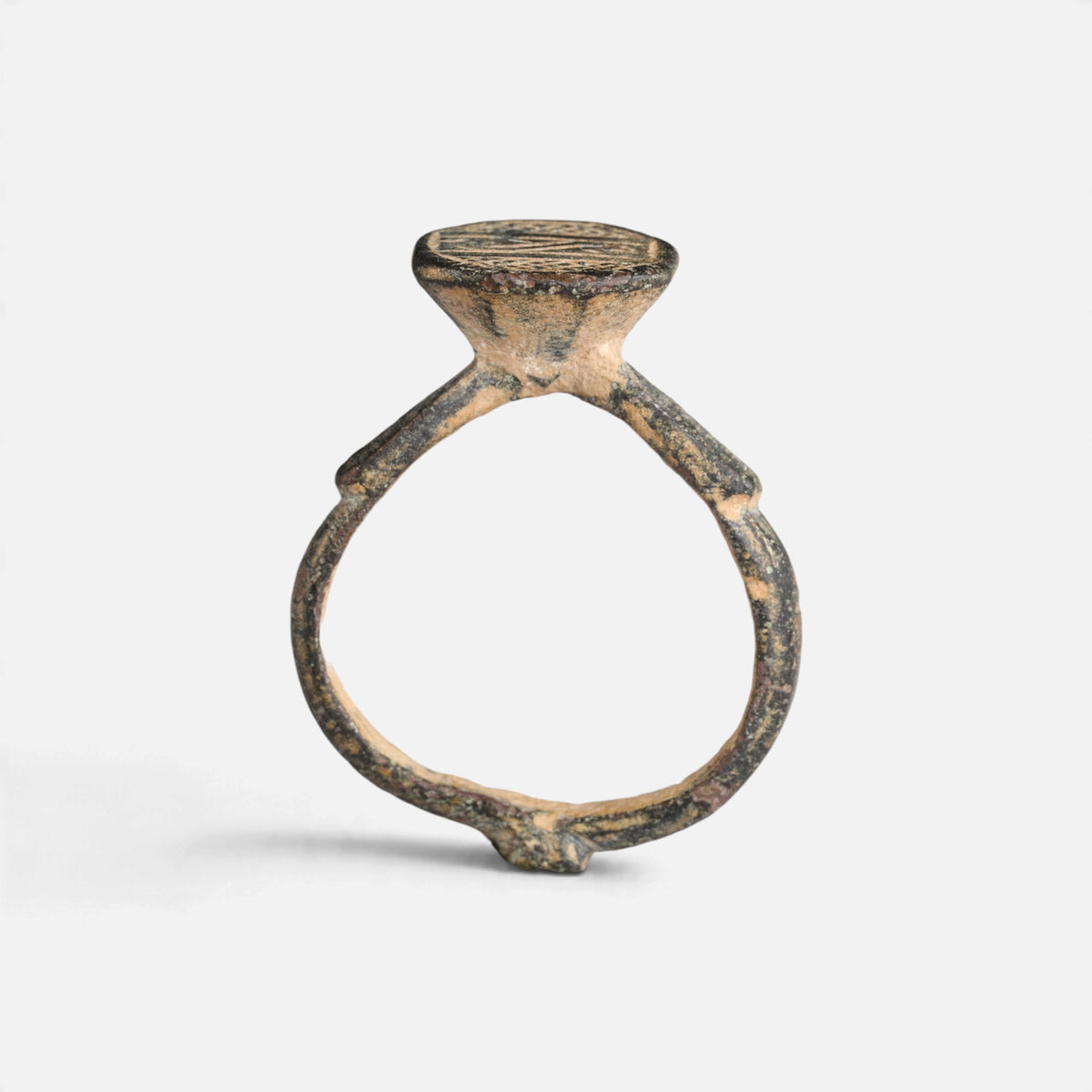 Byzantine bronze ring 'Damianos' shows its raised bezel neck and complete hoop in profile.